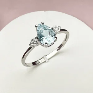 anello comete oro bianco e pietra azzurra goccia kanq002